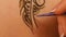 Woman`s hand decorated with henna tattoo, mehendi