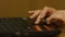 A Woman`s hand with the fingers on a laptop mousepad. Woman`s hand using laptop mouse