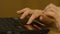 A Woman`s hand with the fingers on a laptop mousepad. Woman`s hand using laptop mouse