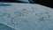 Woman`s hand finishes writing love with heart symbol on snow covered hood of car