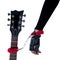 Woman\'s hand handcuffed to the guitar