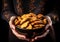 Woman\\\'s hand hold a bowl with delicious cookies. Christmas time. AI generated