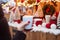 Woman's hand holding cup of hot drinks on street at Christmas fair with city lights bokeh on background. Winter