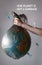 A woman`s hand holding a garbage bag with a globe of planet Earth.The inscription OUR PLANET IS NOT A GARBAGE. Concept of