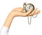 Woman`s hand holding a retro pocket watch with chainlet