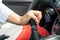 Woman\'s hand holding a the shift lever in a car