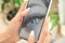 Woman& x27;s hand holding smartphone device with macro eyelash extensions picture