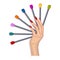 A woman\\\'s hand holds samples with nail colors.