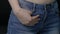 Woman`s hand in jeans pocket