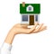 Woman`s hand offer a small model of white realistic house with g