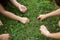 Woman`s Hand picking up pieces of paper in garden, hand holding