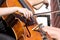 Woman\'s hand playing cello in the orchestra