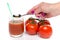 Woman\'s hand putting celery salt in a glass