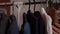 Woman's Hand Selects Things on a Hanger Close-up