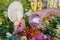 Woman`s hand sprinkling scented water with rose petals on the Buddha Image