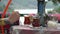 A woman`s hand stirs sugar against the background of the mountains in Alanya