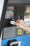 Woman\'s Hand Swiping Card At Fuel Station