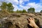 Woman\'s hand touching the large stones on the ground in a strange landscape of the city of Encantada de Cuenca,