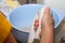 Woman`s hand using an electric mixer in a blue bowl baking and preparing food for eating with family