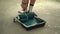 Woman\'s hand wets a roller in a tray with blue paint. Creativity and home renovation concept. Finishing and decorating