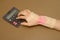 Woman\'s hand with wrist support doing calculations