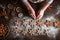 Woman\\\'s hands baking a batch of fresh gingerbread