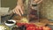 Woman`s hands closeup preparing products for pizza and preparing it for baking