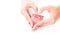 Woman`s hands with condom and heart shape hand sign, Love and Sa