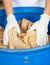 Woman\'s Hands Discarding Bread Waste In Garbage