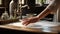 a woman& x27;s hands engaged in the cleaning process, with the tabletop gleaming after being polished. The composition