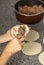 Woman`s hands filling an Argentine meat empanada