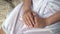 Woman`s hands, girl sitting in white bathrobe