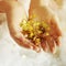 Woman\'s hands holding golden tinsel stars