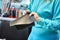 Woman`s hands holding a piece of leather. Manufacture of hand-made bags