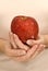 Woman\'s Hands Holding Red Apple