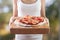 Woman\'s hands holds homemade pizza