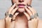 Woman`s hands with jewelry rings