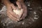 Woman\'s hands kneading dough