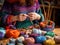 woman\\\'s hands knitting soft and colorful woolen threads