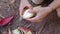 Woman\\\'s hands peeling banana blossoms in the garden