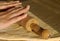 Woman\'s hands rolling dough