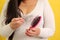 Woman\\\'s hands take a hairbrush with many fallen hairs after brushing for alopesia, anemia or postpartum disease