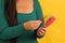 Woman\\\'s hands take a hairbrush with many fallen hairs after brushing for alopesia, anemia or postpartum disease