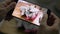 Woman`s hands taking picture of prepared dragon fruit on wooden cutting board by using mobile phone.