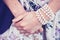 Woman\'s hands wearing a pearl bracelet