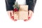 Woman`s hands wrapping Christmas gift box