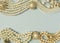 Woman`s Jewelry. Vintage jewelry background. Beautiful gold tone and pearls brooches, braceletes, necklaces and earrings on blue