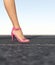 Woman`s leg in pink shoe