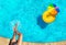 Woman`s legs, inflatable ring swim in pool