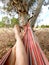 Woman\'s legs lying on hammock